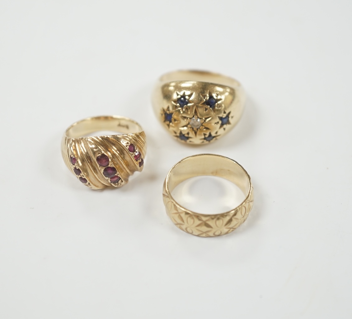 Two modern 9ct gold and gem set dress rings and a similar engraved 9ct gold band